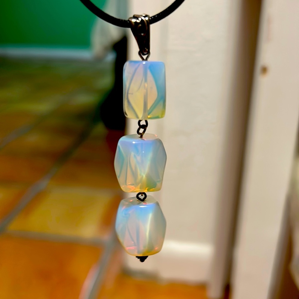 3 opal stone on a leather necklace.